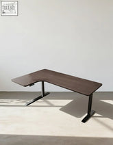 Modern l-shaped damico electric standing office desk with dark wood tabletop and sleek black metal legs for computer corner use