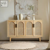 Light wood daphne rattan sideboard with arched cane panel doors and dark metal handles in ash wood finish