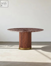 Darcy round dining table with polished rosewood marble top and fluted wooden base with brass ring trim