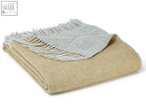 Folded desert brown dartmoor reversible pure new wool throw blanket with fringed edges and blanket size guide tips