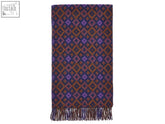 A dartmouth shetland pure new wool throw in rust purple with geometric diamond pattern and fringed edges