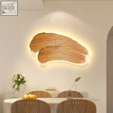 David simple style wall-mounted clock with natural wood finish gold-tone numerals and warm illuminated edge without lights