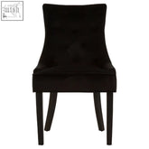 Daxton black velvet dining chair with tufted back and sleek tapered legs perfect for stylish dining rooms