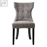 Daxton grey leather dining chair with gray tufted velvet upholstery and black rubberwood legs with nailhead trim