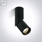 Black cylindrical adjustable spotlight with matte finish and visible led bulb meets standard en60598-1 for decorative use