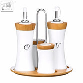 White ceramic oil and vinegar dispensers with bamboo tops and black lettering from dela 4pc bamboo ceramic condiment set