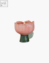 Pink ceramic tulip-shaped delphine scented candle holder with green stem and leaf accent shipping cost info available