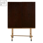 Dark wood delta walnut veneer drinks cabinet with gold-tone metal legs and black caps for stylish storage