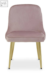 A demi dusky pink velvet dining chair with soft blush pink velvet upholstery and sleek gold metal legs