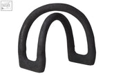 Black textured rubber horse bit guard with intersecting lines design for protecting coffee tables and furniture edges
