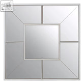 Silver-framed large solar effect wall mirror with geometric design and central square panel surrounded by angled segments