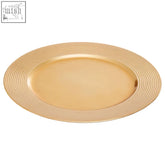 Gold charger plate with a ribbed rim and textured edge perfect for elegant table settings