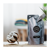 Silver pouch of dank mer laundry bombs diffuser refill 100g with white cap and black circular logo for freshening clothes