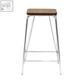 A sleek chrome metal square bar stool with an elm wood square seat perfect for modern wood square bar setups