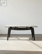 Dobson dining table with sleek black frame and white marble sintered stone top perfect for dining room use