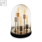 Glass dome lamp with amber glass dome and vintage filament bulbs on a black base for a stylish glass table lamp