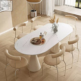 White marble-effect oval doreen dining table with single pedestal base and minimalist design for dining room