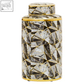 A sleek large marble effect ceramic jar with black and white geometric mosaic pattern and gold trim detailing