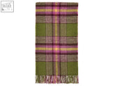A soft olive green plaid dorset shetland pure new wool throw with purple yellow and beige stripes and fringe