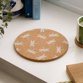 Circular cork pot stand with heat resistant white dragonfly silhouettes pattern for stylish pot stands
