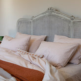 Gray antique-style cane headboard with ornate carved detailing in yarn dyed cotton from duncan apricot collection