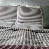Striped duvet cover and matching pillowcases in duncan espresso yarn dyed cotton with beige gray and light blue tones
