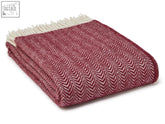 Folded dune pure new wool throw in beet with burgundy cream herringbone pattern and white fringe