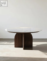 Modern round dunlap dining table with white sintered stone top and dark wood curved legs for stylish dining spaces