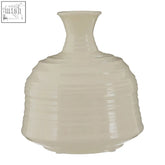 Cream-colored ribbed ceramic vase with a fluted body and slender neck perfect as a small ceramic vase