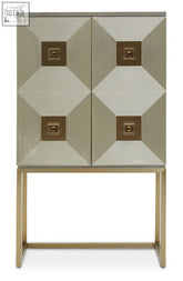 A modern duvali two door cabinet with metallic silver and gold finish and brass accented recessed panels