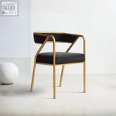 Modern black leather dwight dining chair with sleek gold metal frame perfect for stylish dining spaces