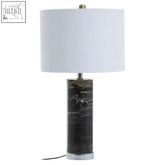 Ebony black marble table lamp with white cylindrical shade and clear glass base on a chrome base for stylish lighting