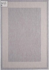 A rectangular ecology outdoor rug grey with textured center and cream borders featuring subtle diagonal weave patterns