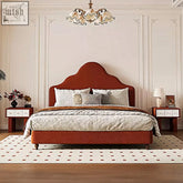 A plush rust-colored velvet elara double bed with curved headboard and footboard king size flannelette