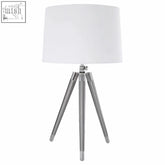 Electrum tripod table lamp with cream linen shade and polished chrome legs for modern home decor