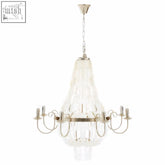 A sleek modern elena 8 bulb seashell chandelier with clear glass body and polished metal arms perfect for stylish lighting