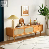 Light wood elijah rattan tv stand with woven cane panels and round metal handles in oak finish