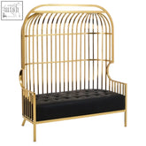 Gold dome cage two seat sofa featuring a gold birdcage style frame with black tufted cushion seating