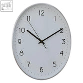 Elko oval wall clock with silver finish featuring a minimalist white face and black numerals for easy reading