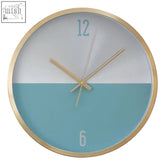 Elko wall clock with gold finish aluminium case and a two-tone white and teal face with simple numerals at 12 and 6