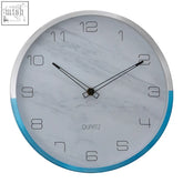 Elko wall clock with silver rim and blue accent band on white marble patterned face