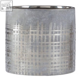 Silver metallic cylindrical candle holder with brushed finish and subtle grid pattern for grey ceramic planter decor