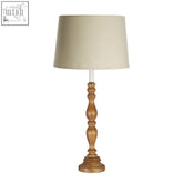 Emely candle table lamp with warm wooden round base and beige cotton mix fabric shade for cozy lighting