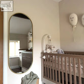 Emi 150x60cm full length oval mirror with gold metal frame in matte gold perfect for runway style spaces