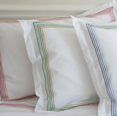 White pillowcases with colorful embroidered rainbow borders perfect for empress green duvet cover sets