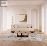 Cream-colored endo sofa with circular cushions and a wooden base perfect for stylish living rooms