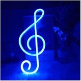 A glowing blue neon light in the shape of a treble clef from enuoli music note neon signs perfect for wall decor