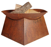 Rustic copper-toned esschert design metal fire pit with geometric base and stacked logs inside for outdoor use