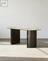 Elegant esther oval dining table with white marble top and dark vertically ribbed metal legs perfect for dining room