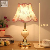 European minimalist glass table lamp with a delicate floral glass table lampshade and ornate brass base with cream globe